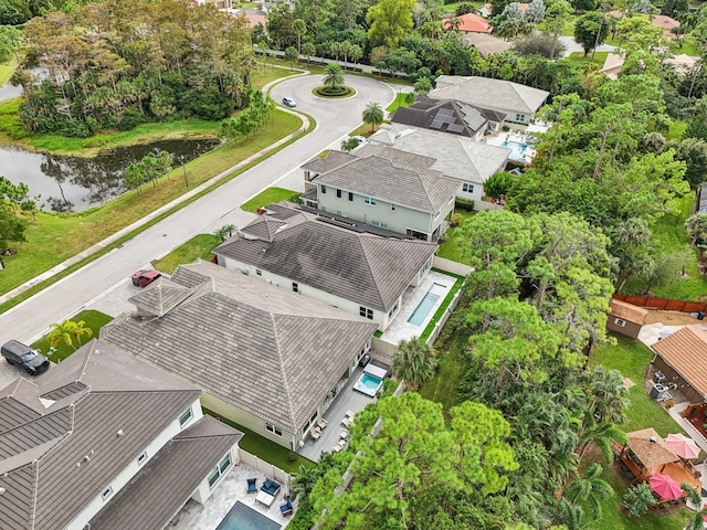 drone / aerial view with a water view