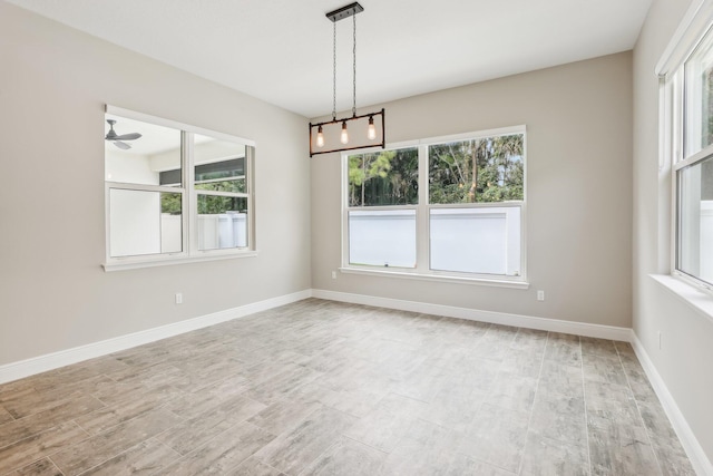 unfurnished room featuring ceiling fan and light hardwood / wood-style floors