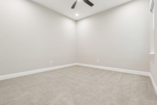 unfurnished room with light carpet and ceiling fan