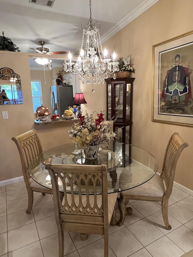 dining space with light tile patterned floors, ceiling fan with notable chandelier, and ornamental molding