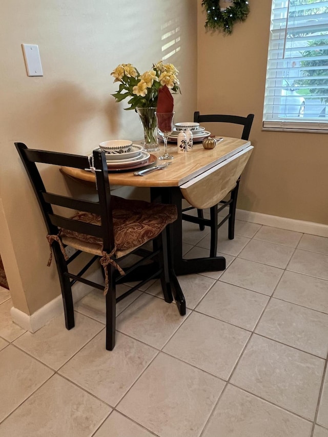 dining area featuring light tile patterned floors