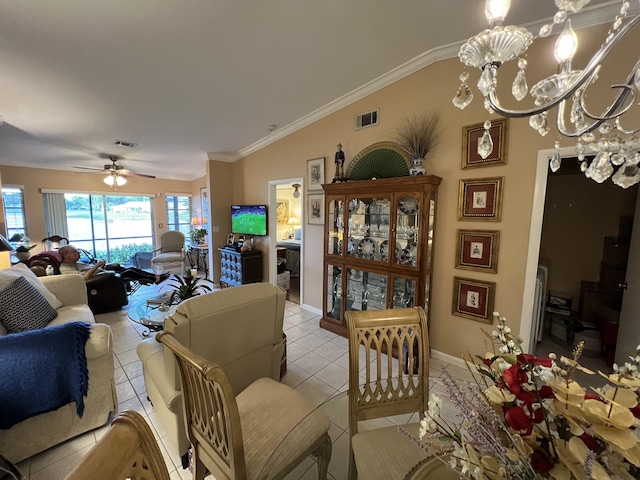 tiled living room with ceiling fan with notable chandelier, lofted ceiling, and crown molding