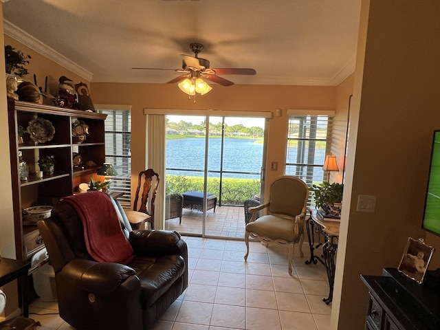 sitting room featuring ceiling fan, plenty of natural light, light tile patterned floors, and ornamental molding