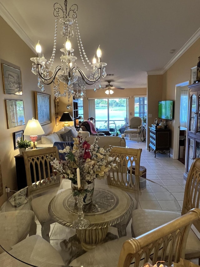 dining room featuring crown molding, light tile patterned floors, and ceiling fan with notable chandelier