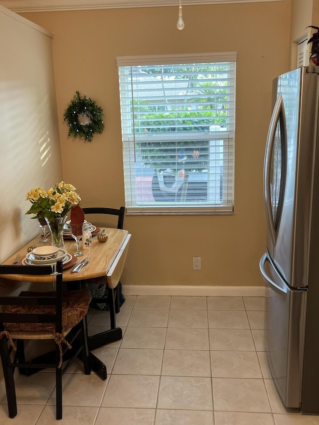 tiled dining area with a wealth of natural light