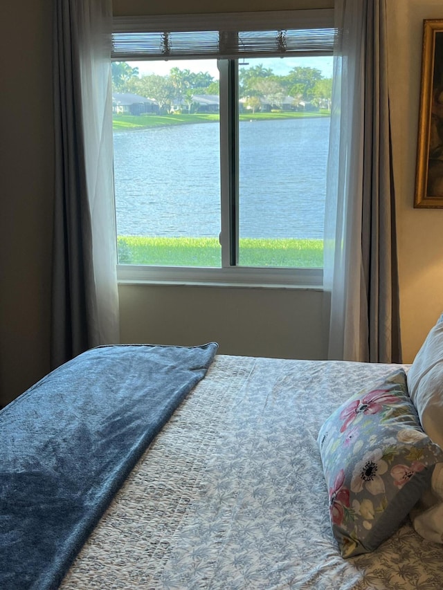 bedroom with a water view