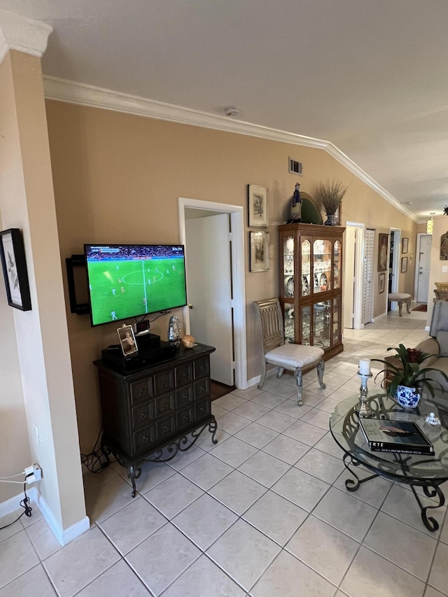 tiled living room featuring ornamental molding and vaulted ceiling