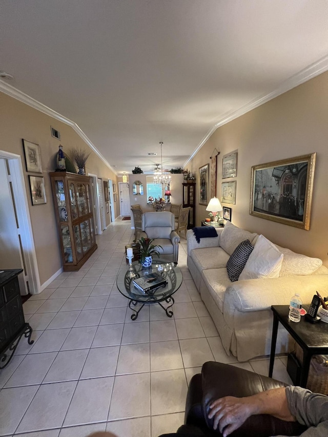 tiled living room featuring ceiling fan, vaulted ceiling, and ornamental molding