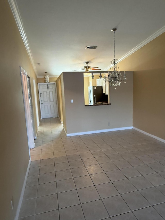 interior space with tile patterned floors, ceiling fan with notable chandelier, and crown molding