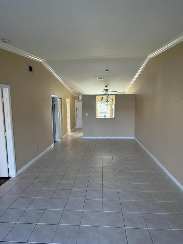 spare room featuring ceiling fan, tile patterned flooring, and ornamental molding