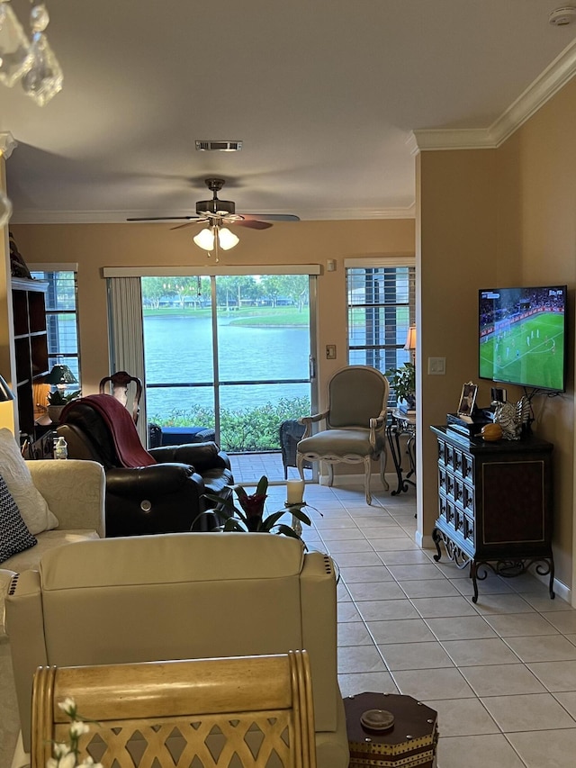 tiled living room featuring ceiling fan and ornamental molding