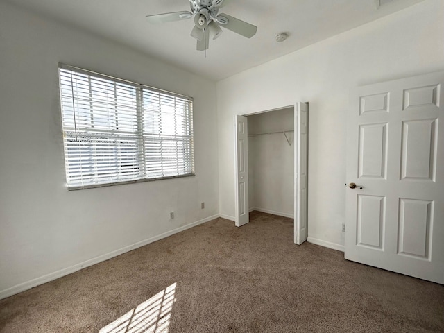 unfurnished bedroom with carpet flooring, ceiling fan, and a closet