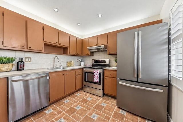 kitchen featuring sink, backsplash, and stainless steel appliances