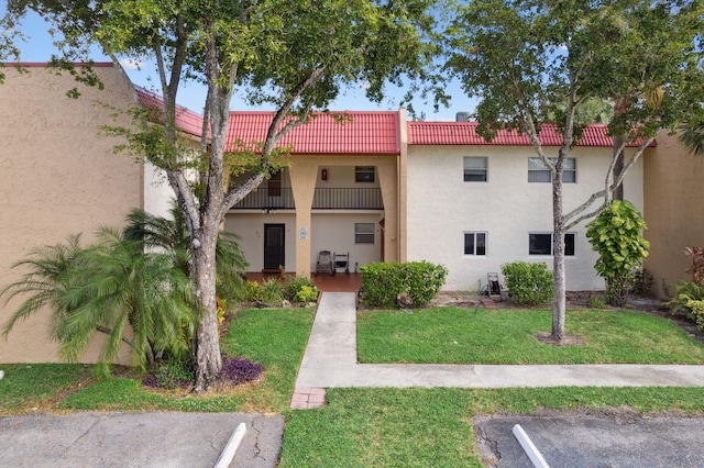 view of property with uncovered parking