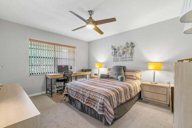 bedroom featuring ceiling fan and light carpet