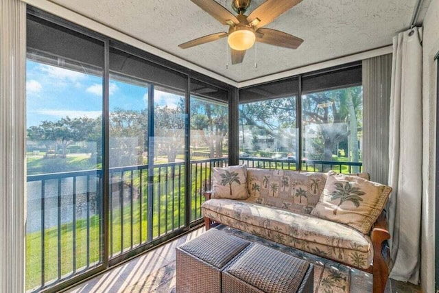 sunroom featuring ceiling fan