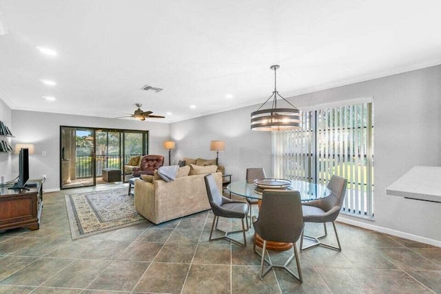 dining space with ceiling fan with notable chandelier and ornamental molding