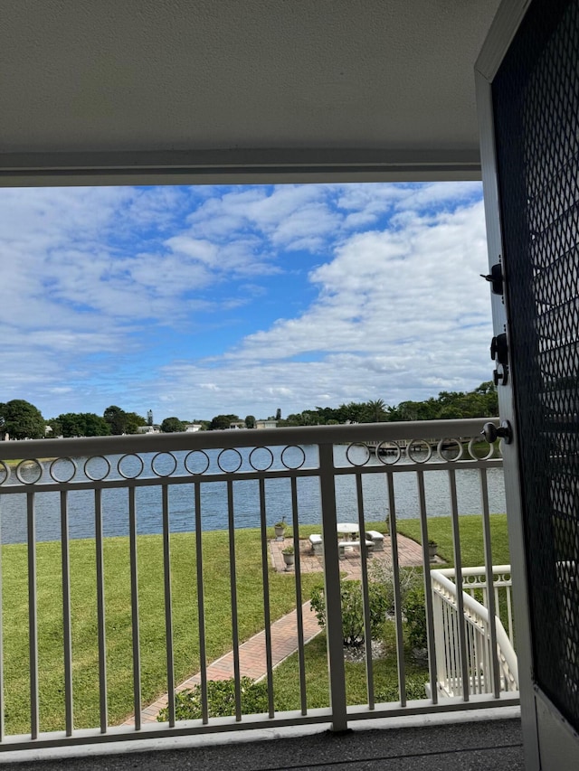 balcony featuring a water view