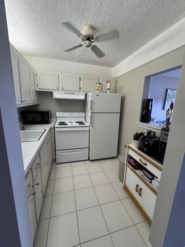 kitchen featuring white appliances, white cabinets, sink, ceiling fan, and light tile patterned flooring