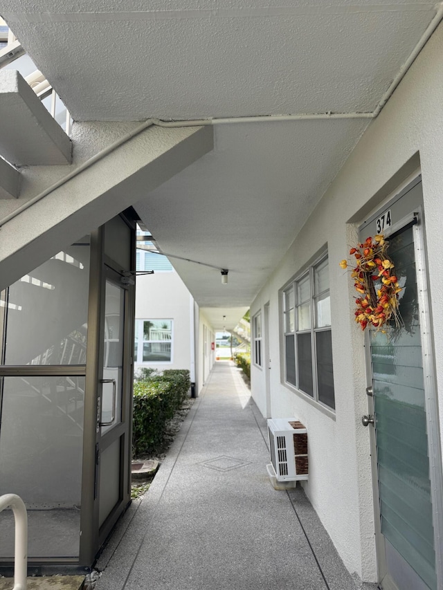 view of patio / terrace with a wall mounted AC