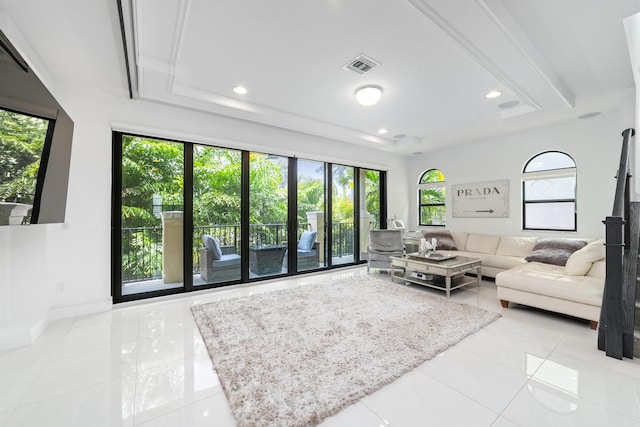 living room featuring a wealth of natural light and light tile patterned floors