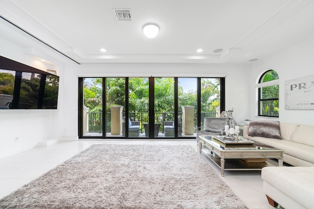 tiled living room with a healthy amount of sunlight