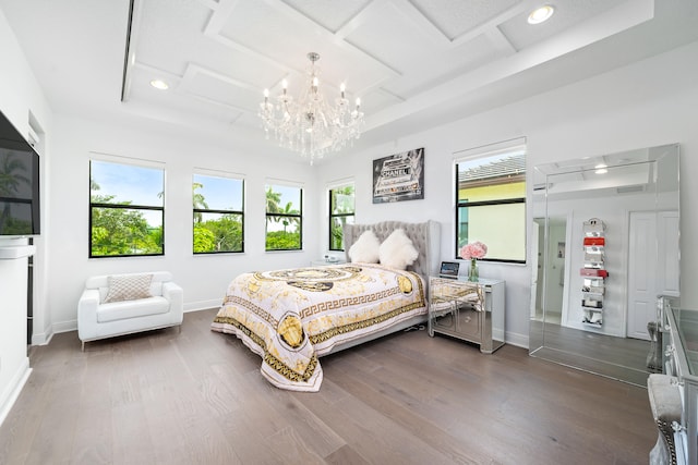 bedroom featuring hardwood / wood-style flooring and multiple windows