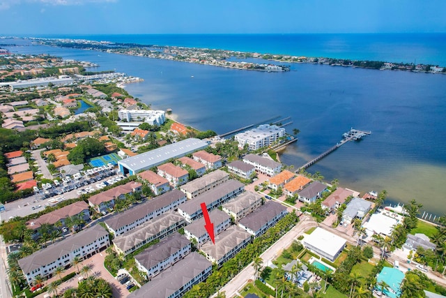 birds eye view of property featuring a water view