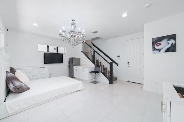 tiled bedroom with an inviting chandelier