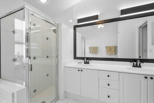 1643 Oak Berry Cir, Wellington, FL 33414 - full bathroom with a shower stall, double vanity, and a ceiling fan