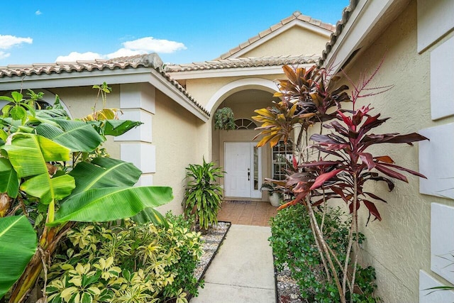 1643 Oak Berry Cir, Wellington, FL 33414 - doorway to property featuring stucco siding and a tiled roof