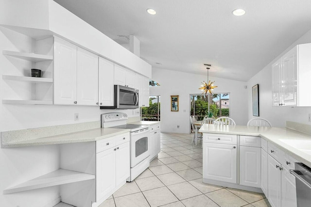 1643 Oak Berry Cir, Wellington, FL 33414 - kitchen with open shelves, appliances with stainless steel finishes, lofted ceiling, white cabinetry, and a chandelier