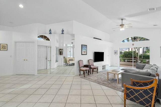 1643 Oak Berry Cir, Wellington, FL 33414 - living room with light tile patterned floors, ceiling fan, and high vaulted ceiling
