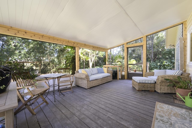 sunroom / solarium with vaulted ceiling