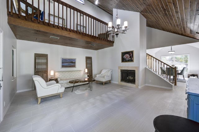 living room with a notable chandelier, wood ceiling, and high vaulted ceiling