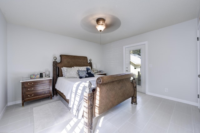 bedroom with ceiling fan and light tile patterned flooring