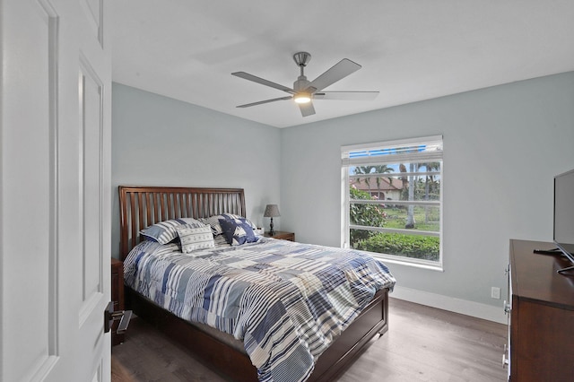 bedroom featuring wood-type flooring and ceiling fan