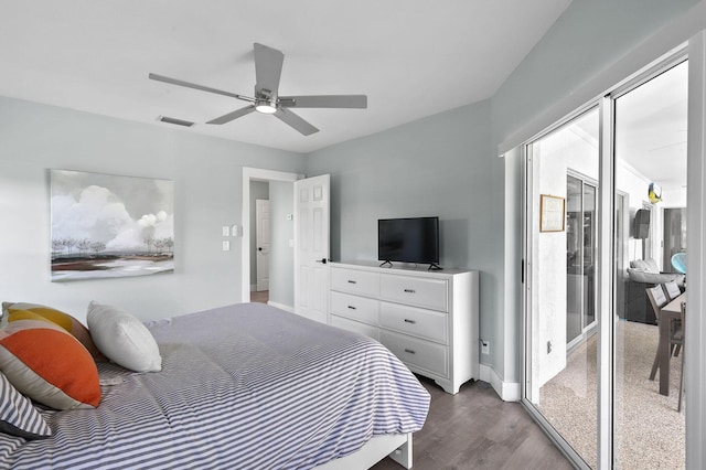 bedroom featuring dark hardwood / wood-style flooring, access to outside, and ceiling fan