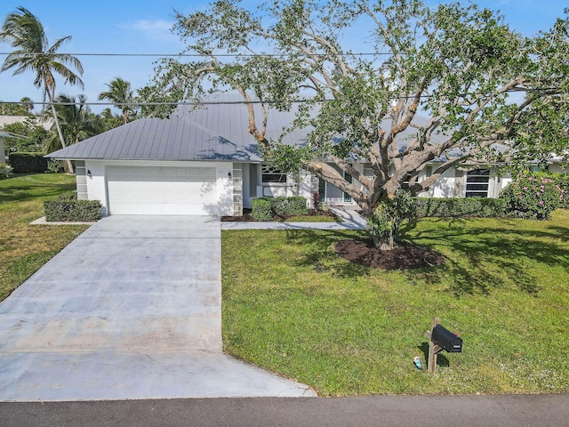 single story home featuring a front lawn and a garage