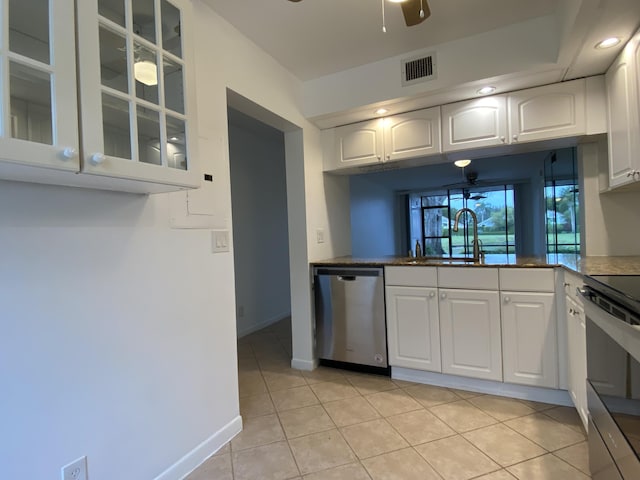 6928 Briarlake Cir Unit 104, Palm Beach Gardens, FL 33418 - kitchen featuring stainless steel dishwasher, ceiling fan, glass insert cabinets, white cabinetry, and recessed lighting