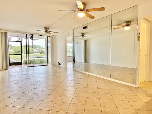 6928 Briarlake Cir Unit 104, Palm Beach Gardens, FL 33418 - unfurnished room with light tile patterned floors and a ceiling fan