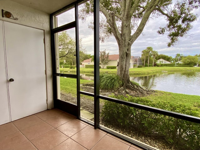 6928 Briarlake Cir Unit 104, Palm Beach Gardens, FL 33418 - unfurnished sunroom with a water view