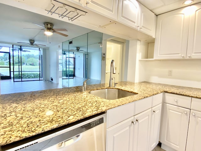 6928 Briarlake Cir Unit 104, Palm Beach Gardens, FL 33418 - kitchen featuring dishwasher, a sink, a ceiling fan, white cabinetry, and light stone counters