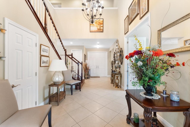 dining room with light tile patterned floors and a chandelier