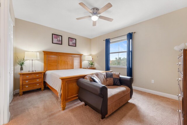 bedroom with light colored carpet and ceiling fan