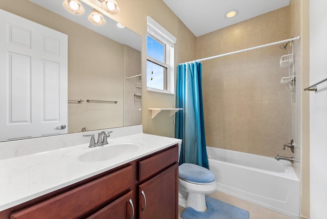 bathroom with tile patterned floors, vanity, and ceiling fan