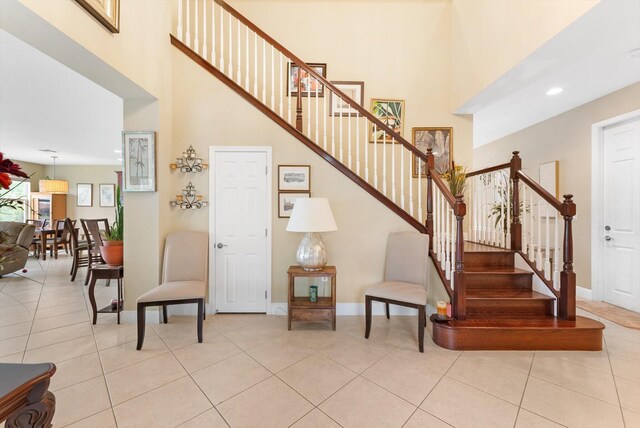 dining room featuring light tile patterned flooring and an inviting chandelier