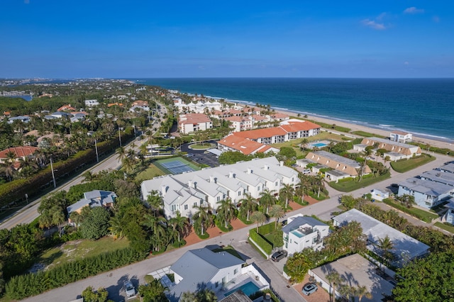 birds eye view of property featuring a water view and a view of the beach