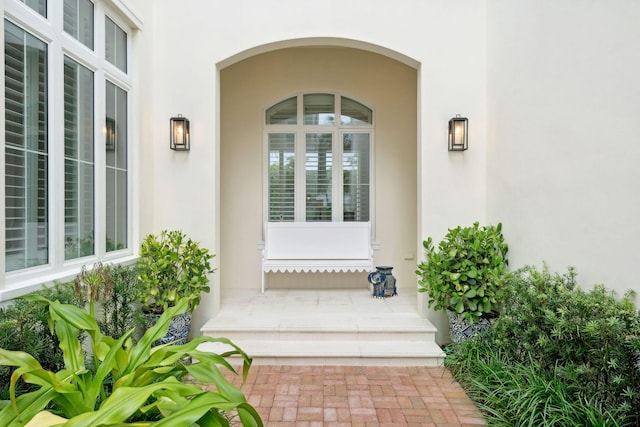 view of exterior entry featuring a porch