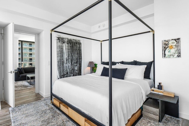 bedroom with wood-type flooring